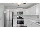 Updated kitchen with stainless steel appliances and white cabinets at 2319 Westland Ml, Acworth, GA 30102