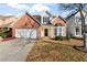 Two-story house with a brick facade and a spacious yard at 6469 Alder Ln, Norcross, GA 30093