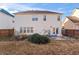 Two-story house back view, showing a patio and yard at 6469 Alder Ln, Norcross, GA 30093