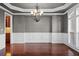 Formal dining room with hardwood floors and chandelier at 517 Lady Fern Pt, Alpharetta, GA 30022