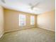 Large bedroom with neutral walls and carpet flooring at 601 Goldpoint Trce, Woodstock, GA 30189