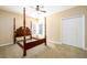 Bedroom with post bed, carpet, and double doors at 601 Goldpoint Trce, Woodstock, GA 30189