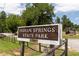 Entrance sign for Indian Springs State Park at 313 Chattahoochee Cir, Locust Grove, GA 30248