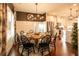 Elegant dining room with a round wooden table and black chairs at 1024 Riverstone Dr, Social Circle, GA 30025