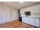 Modern kitchen with white cabinets, granite counters, and black appliances at 3822 Deercreek Dr, Powder Springs, GA 30127