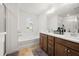 Bathroom with double vanity, soaking tub and separate shower at 7757 Squire Ct, Fairburn, GA 30213