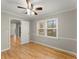 Well-lit bedroom with hardwood floors and neutral-colored walls at 2183 Shillings Chase Nw Dr, Kennesaw, GA 30152