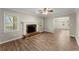 Spacious living room with hardwood floors, fireplace, and large windows at 2183 Shillings Chase Nw Dr, Kennesaw, GA 30152