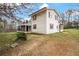 White two-story house with screened porch and large yard at 25 Sixth St, Villa Rica, GA 30180