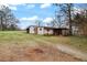 Detached shed or workshop with gravel driveway at 25 Sixth St, Villa Rica, GA 30180