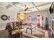 Living room with hardwood floors, fireplace and large windows at 505 Mirror Lake Pkwy, Villa Rica, GA 30180