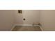 Small laundry room with tile floor and hookups at 1829 Olive Springs Se Rd, Marietta, GA 30060