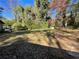 Large backyard with mature trees and a mostly grassy yard at 4195 Blanton Sw Ave, Atlanta, GA 30331