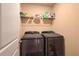 Laundry room with washer, dryer, and shelving at 3671 Falconwood Dr, Douglasville, GA 30135