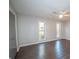 Well-lit bedroom with two windows and ceiling fan at 7156 Whitfield Dr, Riverdale, GA 30296