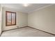 Bright bedroom featuring a large window with shutters at 755 Wickerberry Knl, Roswell, GA 30075