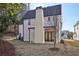 Rear view of the house showcasing a large backyard at 120 Thome Dr, Alpharetta, GA 30022