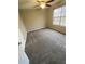 Bedroom with ceiling fan and grey carpeting at 216 Ridgedale Way, Hoschton, GA 30044