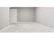 Ample basement room, freshly painted with grey walls at 2216 Golden Dawn Sw Dr, Atlanta, GA 30311