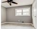 Spacious bedroom with gray walls, new flooring, and large window at 2216 Golden Dawn Sw Dr, Atlanta, GA 30311