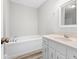 Bathroom with soaking tub and white vanity at 6764 Creek Valley Way, Douglasville, GA 30134