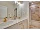 Modern bathroom with double vanity, gold fixtures, and a large shower at 1994 Drew Dr, Atlanta, GA 30318