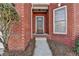 Brick front entrance with a dark wooden door and small steps at 2638 Hooch Ct, Duluth, GA 30097