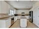 White kitchen with stainless steel appliances and an island at 2638 Hooch Ct, Duluth, GA 30097