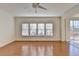 Bright living room with hardwood floors and view into kitchen at 2638 Hooch Ct, Duluth, GA 30097