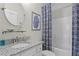 Clean bathroom with granite countertop and shower/tub combo at 605 Longleaf Trce, Canton, GA 30114