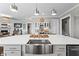 Modern kitchen island with a farmhouse sink and wine storage at 605 Longleaf Trce, Canton, GA 30114