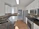 Galley kitchen with granite countertops and stainless steel appliances at 303 Brandie Ct, Canton, GA 30115