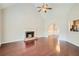 Spacious living room featuring hardwood floors, a fireplace, and high ceilings at , Acworth, GA 30101