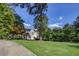 Stunning white home with a large lawn and mature trees at 3119 Habersham Nw Rd, Atlanta, GA 30305