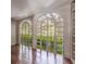 Sunroom with arched windows and hardwood floors at 3119 Habersham Nw Rd, Atlanta, GA 30305