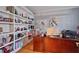 Home office with built-in shelving and a large wooden desk at 625 Piping Rock Pt, Lawrenceville, GA 30043