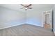 Spacious bedroom with wood-look flooring and ceiling fan at 310 Ferndale Sw Dr, Mableton, GA 30126