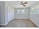 Bedroom with double door closet and wood-look flooring at 310 Ferndale Sw Dr, Mableton, GA 30126