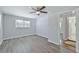 Light and airy bedroom with wood-look floors and access to bathroom at 310 Ferndale Sw Dr, Mableton, GA 30126