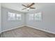 Spacious bedroom with two windows and ceiling fan at 310 Ferndale Sw Dr, Mableton, GA 30126