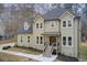 Two-story house, light beige siding, dark gray roof, and a landscaped yard at 2170 Charleston Pl, Lithia Springs, GA 30122