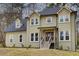 Two-story house with light beige siding, dark gray roof, and a wooden front porch at 2170 Charleston Pl, Lithia Springs, GA 30122