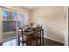 Bright dining area with wood table and chairs, and sliding door to patio at 257 Country Club Dr, Jonesboro, GA 30238