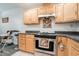 Kitchen with light wood cabinets and stainless steel appliances at 1512 Stoneleigh Way, Stone Mountain, GA 30088