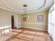 Formal dining room with hardwood floors and a chandelier at 1877 Kennard Court, Snellville, GA 30078