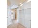 Hallway with built-in shelving and carpet at 1877 Kennard Court, Snellville, GA 30078