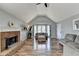 Spacious living room with vaulted ceiling, hardwood floors, and brick fireplace at 13 Maplewood Ct, Acworth, GA 30101