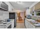 Open concept kitchen with white cabinets and view of dining area at 1093 Kipling Se St, Atlanta, GA 30315