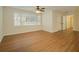 Bright bedroom with hardwood floors and a window at 4245 Sterling Pointe Dr, Douglasville, GA 30135