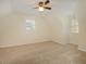 Bright bedroom with sloped ceilings, carpet, and ceiling fan at 4245 Sterling Pointe Dr, Douglasville, GA 30135